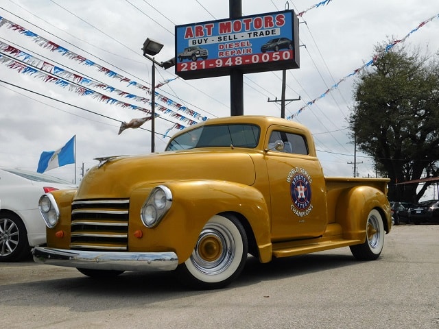 Classic Chevy truck front three-quarter with Houston Astros World Series Champions emblem