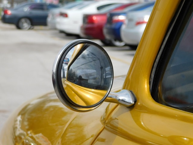 Classic car chrome side mirror reflection